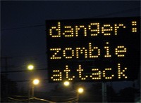 danger zombies ahead hacked road sign