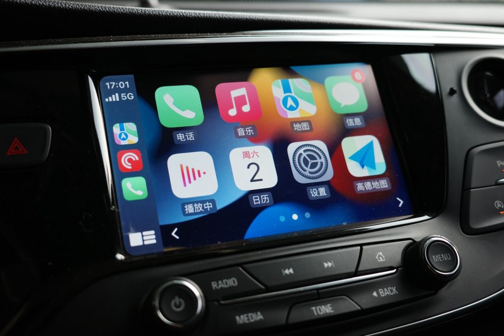 a car dashboard with various app icons on it