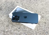 an iphone 11 pro sitting on top of a white box