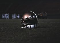 football helmet on green grass field during night time