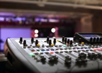 Photo by Mitchell Leach closeup photography of gray audio mixer