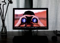 Photo by Glen Carrie television showing man using binoculars